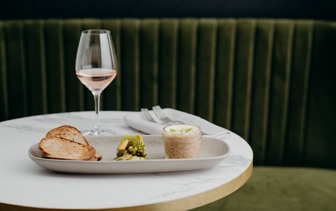 pate and crisp bread with a glass of wine